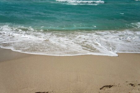 Ocean sand water photo