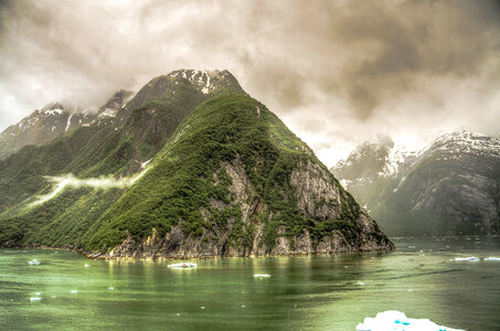 Black Clouds over rising hills in the Fjord around Juneau, Alaska photo