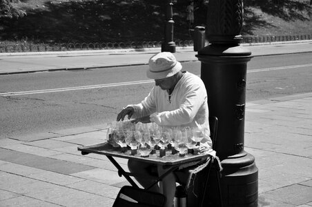 Street musician playing the wine glasses photo