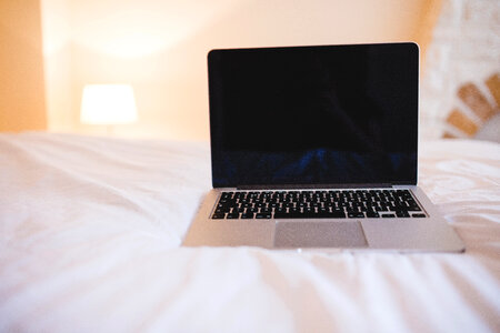 MacBook on Bed photo