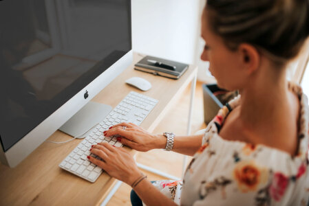 Woman on Computer Typing photo