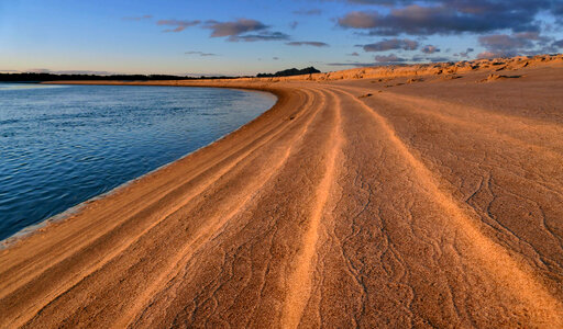 Tide lines at Sunset on the shore photo