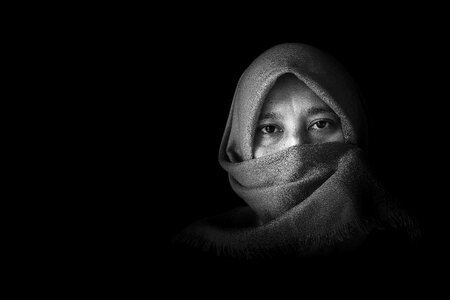 Black and white arab style hiding face