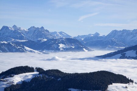 Winter snow above the clouds photo