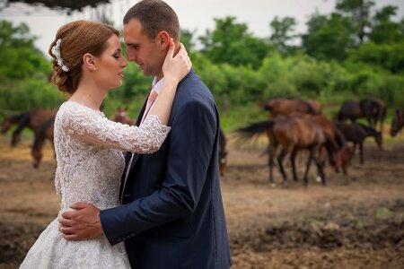 Hugging farm groom photo