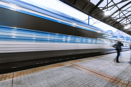 Train in motion passes through station at the main railway station photo