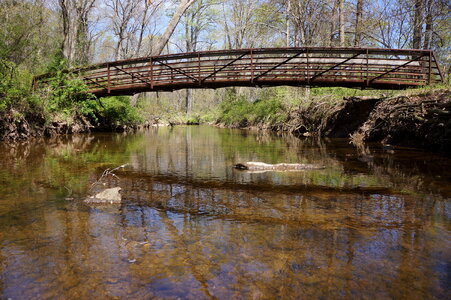 Old bridge in the park in the spring time photo