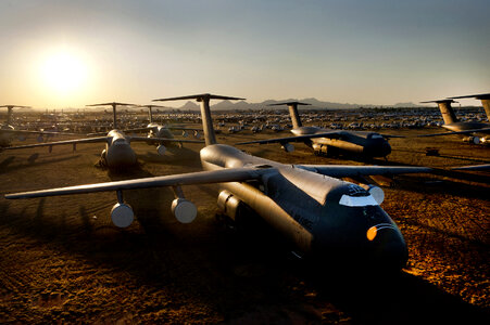 C-5 Galaxy and other aircraft sit at sunset