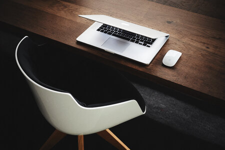 MacBook on Wooden Desk photo