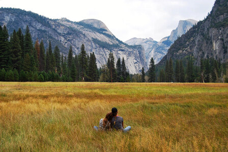 Couple looking at landscape in Yosemite National Park, California photo