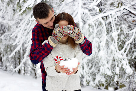 Couple Playing with Snow, Outdoors photo