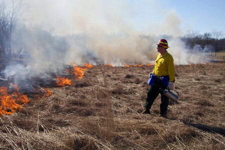 Firefighter watches burn