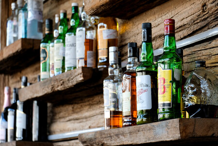 Alcoholic Drinks on the Shelves of a Bar photo
