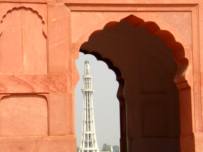 Minar-e-Pakistan richly framed by an aisle arch in Lahore photo