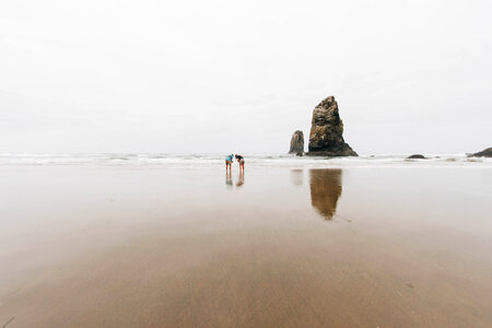 Two people on the beach in Oregon photo
