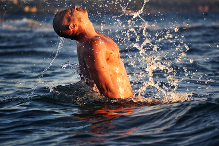Man Splashing Water in the Sea photo