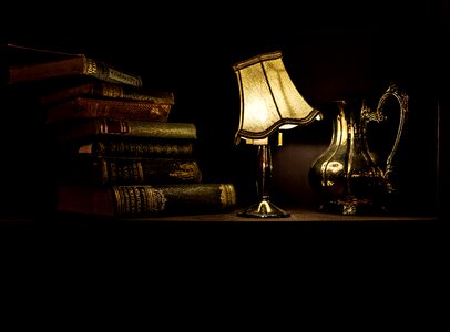 Lamp and old book photo