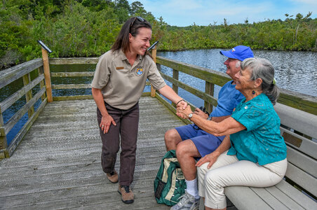 FWS Visitor services staffer greets visitors on boardwalk-1