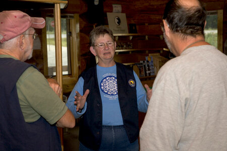 Volunteer with visitors photo