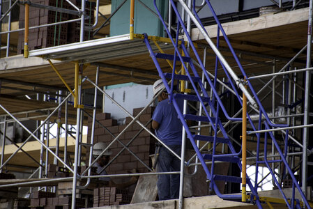 Construction workers inside an unfinished building photo