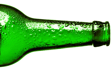 Green Wet Bottle Nozzle with Water Drops photo