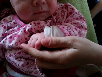 Small child hand finger photo