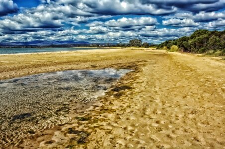 Beach with clouds in the sky in Tasmania, Australia