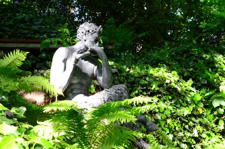 Sculpture mythical creatures figure in the green
