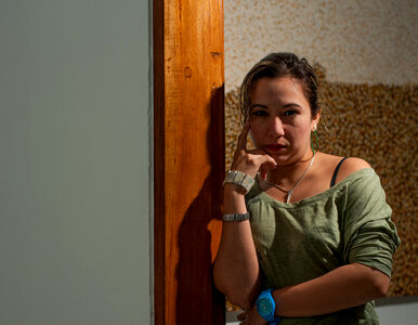 woman leaning against wall photo