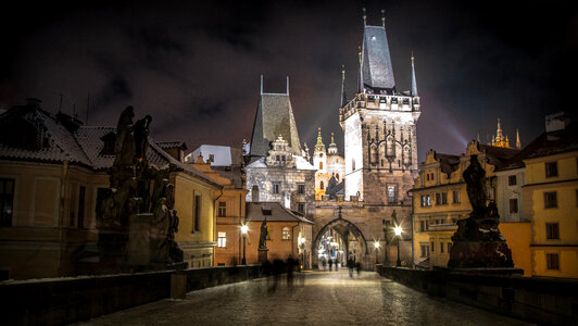 Charles Bridge and night city in Prague, Czech Republic photo