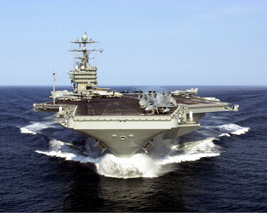 USS Harry S. Truman swiftly cuts through the water photo