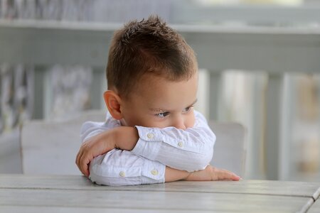 Portrait boy sitting photo