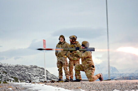 Three Soldiers firing a rocket launchers photo