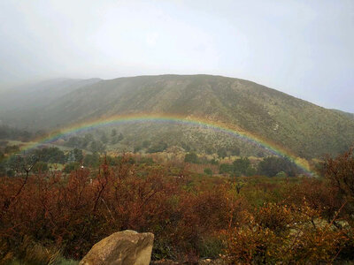 Rainbow under the mountain landscape