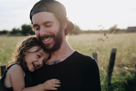 A Father and Daughter on a Meadow photo