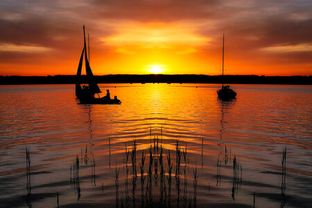 Boats on Lake at Sunset photo
