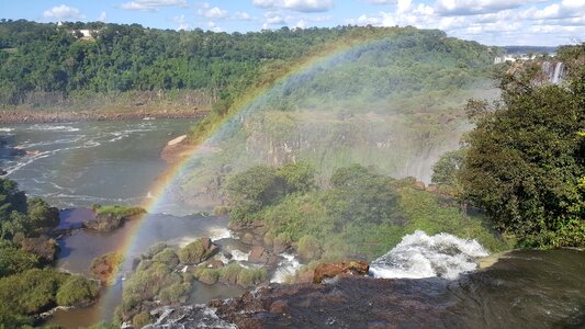 Iguassu waterfalls with rainbow on a sunny day photo