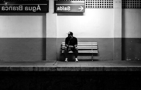 Bench man railway station photo