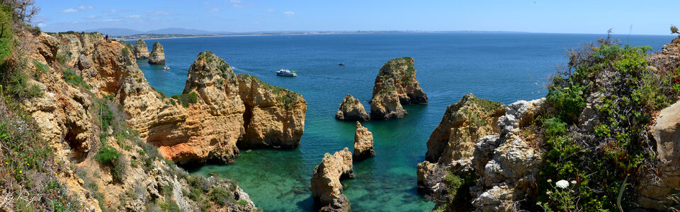 Landscape of the shoreline and rocks and water in Portugal photo