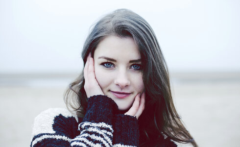 Beautiful Young Woman in a Black and White Knitted Sweater photo