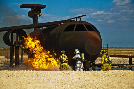 Battling the blaze extinguish a ground fire photo