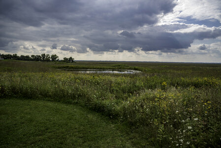 Pond and Field under heavy clouds at Horicon Marsh photo
