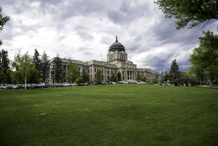 Montana State Capital under the clouds with lawn in Helena
