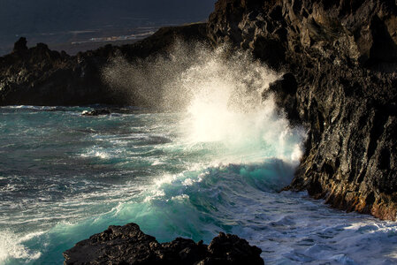 Ocean waves crashing on rocky shores