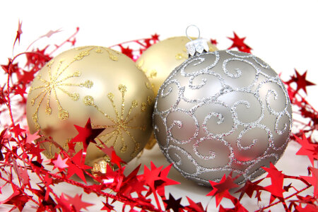 Three golden and silver christmas baubles photo