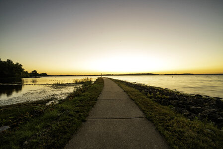 Walkway into the lake at sunrise photo