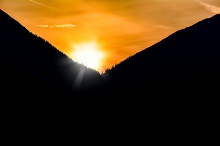 Sun lighting mountains photo