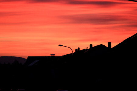 Red-orange sundown in the village photo