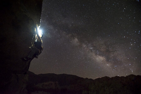 Climbing under the stars at night photo