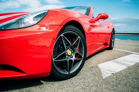Red Sports Car Wheel Close Up photo